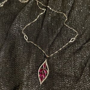 Pretty, long necklace.  Fuschia-coloured, leaf-shaped, pendant.